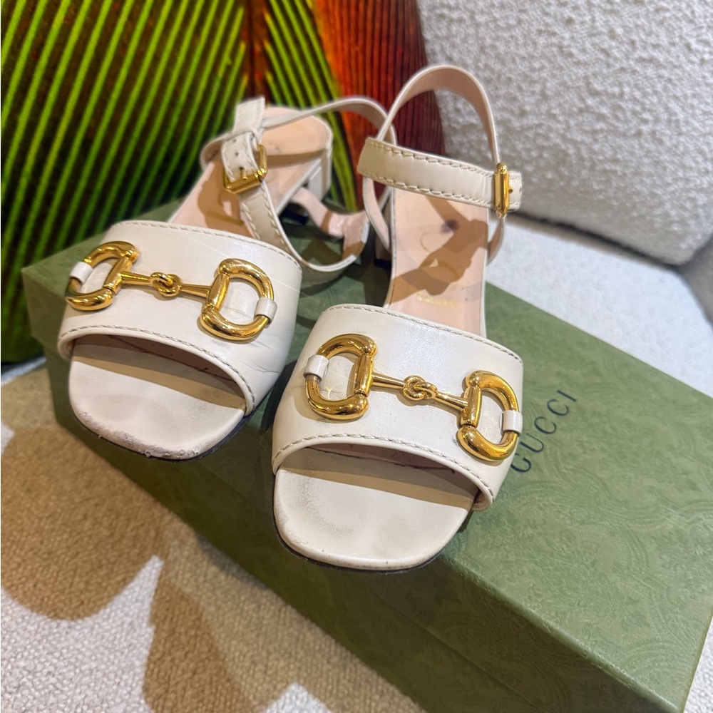 Gucci Women's Cream Sandals with Gold Buckles